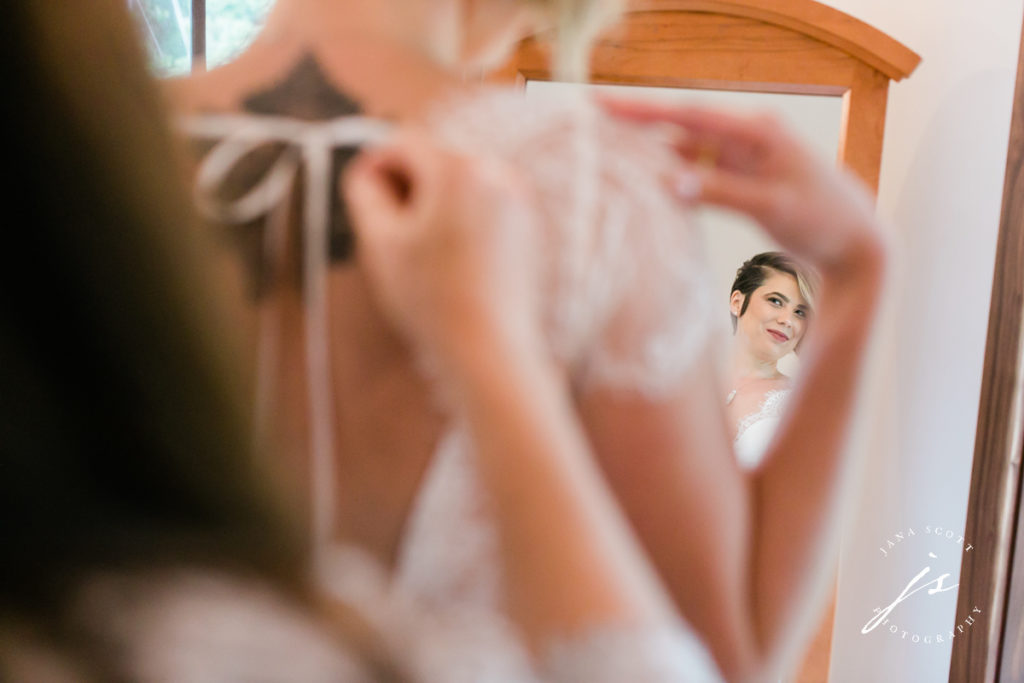 bride looking in the mirror