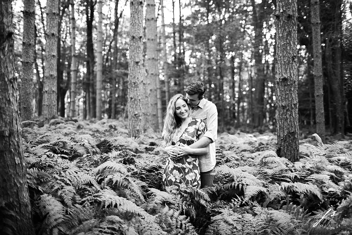 black and white engagement photos in the ferns