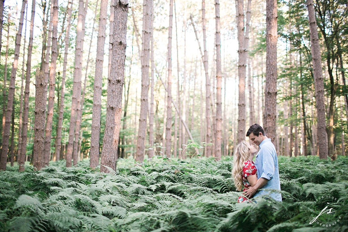 engagement photo in the woods