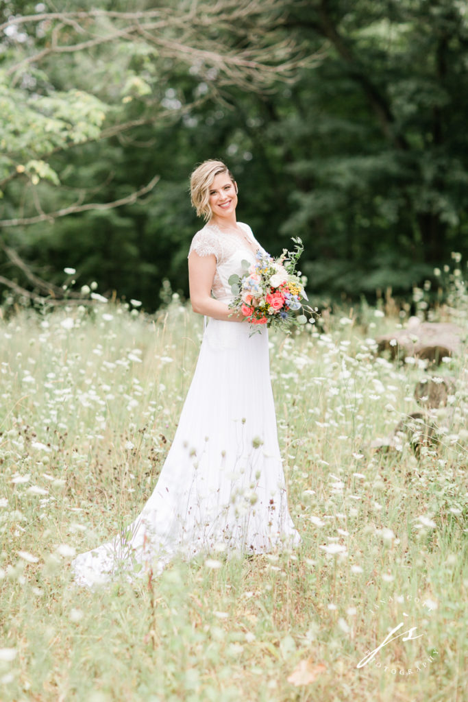 bride in a field of queen annes lace