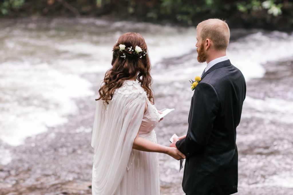 Bride and Groom look at stream during private vow reading
