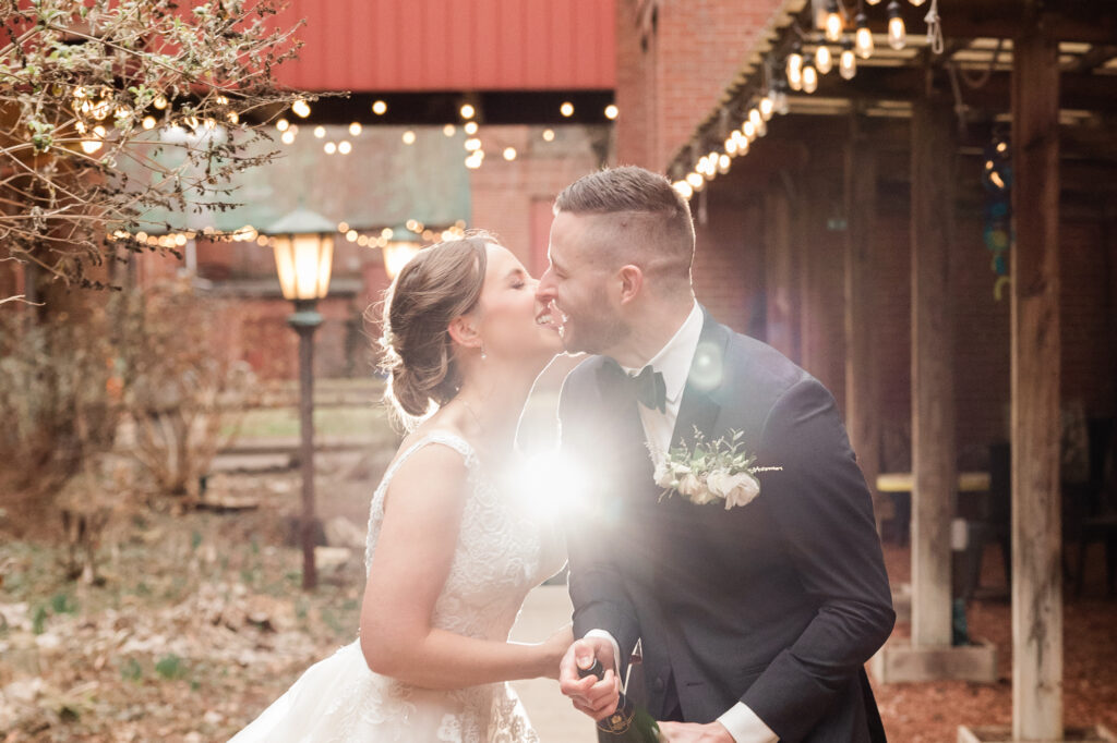 Bride & Groom popping champagne